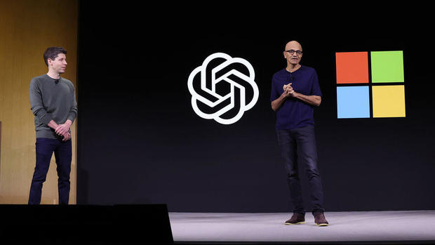 Microsoft CEO Satya Nadella (R) speaks as OpenAI CEO Sam Altman (L) looks on during the OpenAI DevDay event on November 06, 2023 in San Francisco, California. Altman delivered the keynote address at the first ever Open AI DevDay conference.